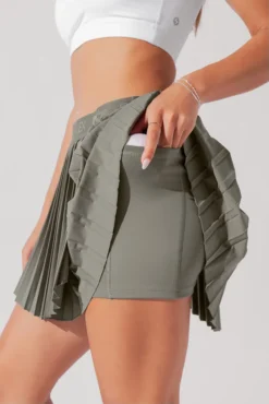 Ace ‘em Pleated Skort - Rustic Olive 17 Ace ‘em Pleated Skort - Rustic Olive -Popflex Store VensusSkort RusticOlive H1002 0984 Edit 1